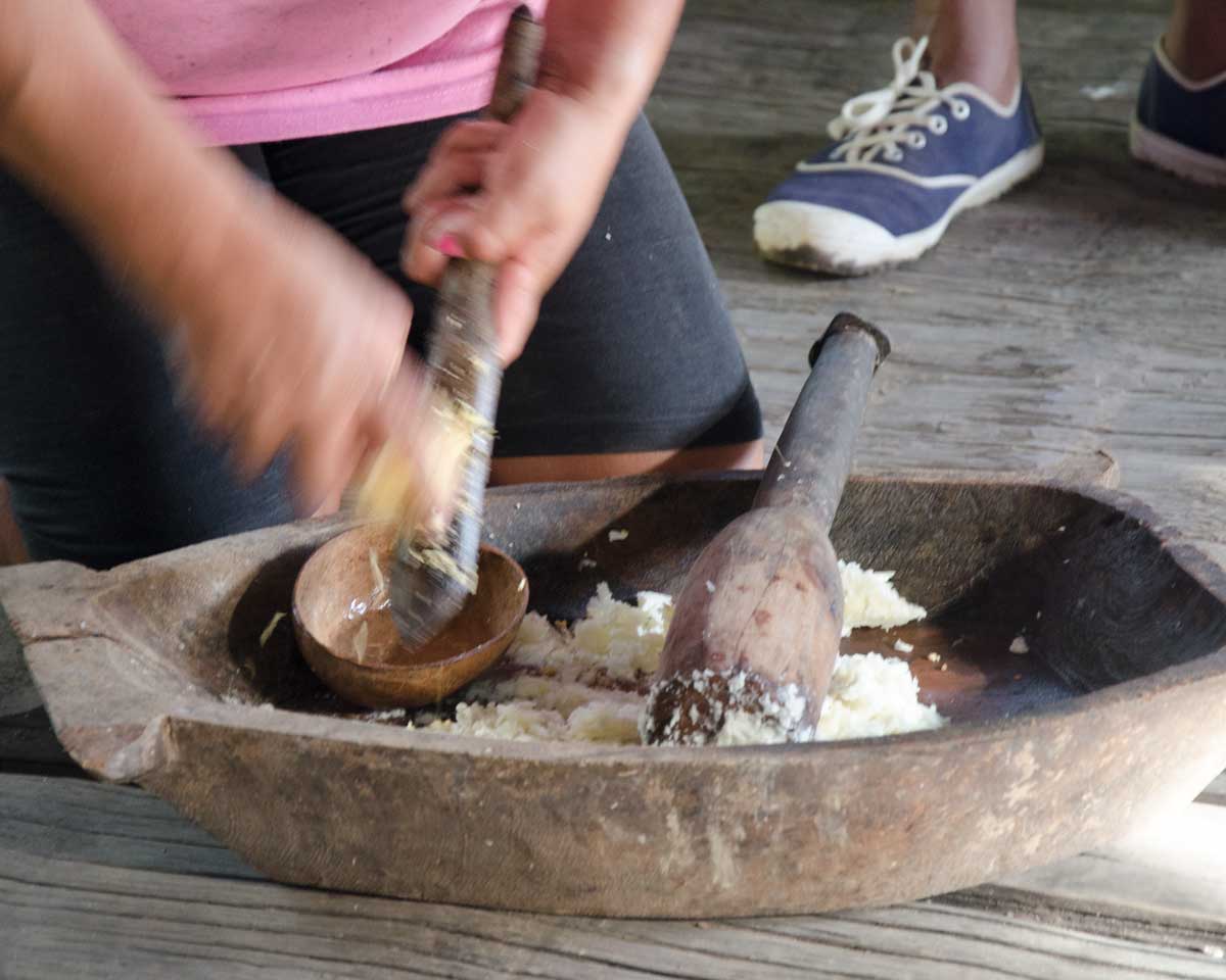 Grating sweet potato to start the Chicha de Yuca, Puerto Napo, Ecuador | ©Angela Drake