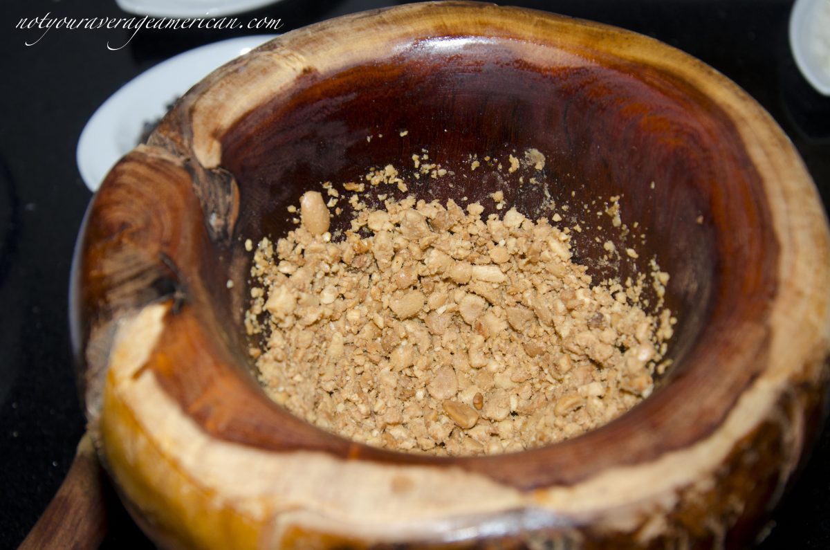 I prefer a mortar and pestle to grind the peanuts. If you choose a food processor, make sure to pulse and not puree.