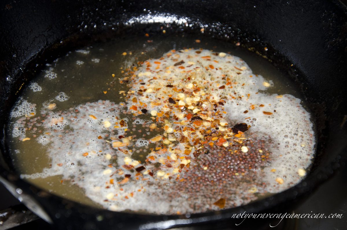 Heat the red pepper flakes and mustard seeds in the remaining oil until the mustards begin to pop.