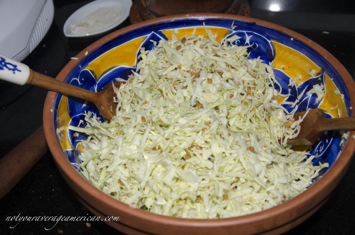 Toss the the ground, roasted peanuts with the coleslaw.