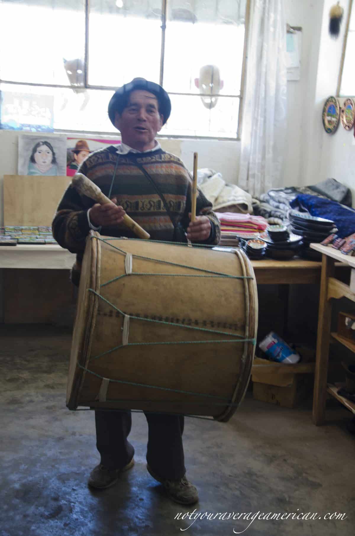 Julio Toaquiza with his drum and pipe.