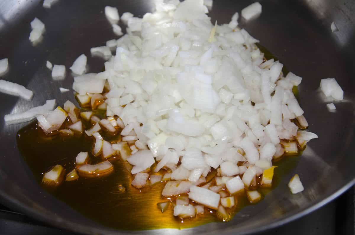 Saute the diced onion in about a tablespoon of achiote oil.