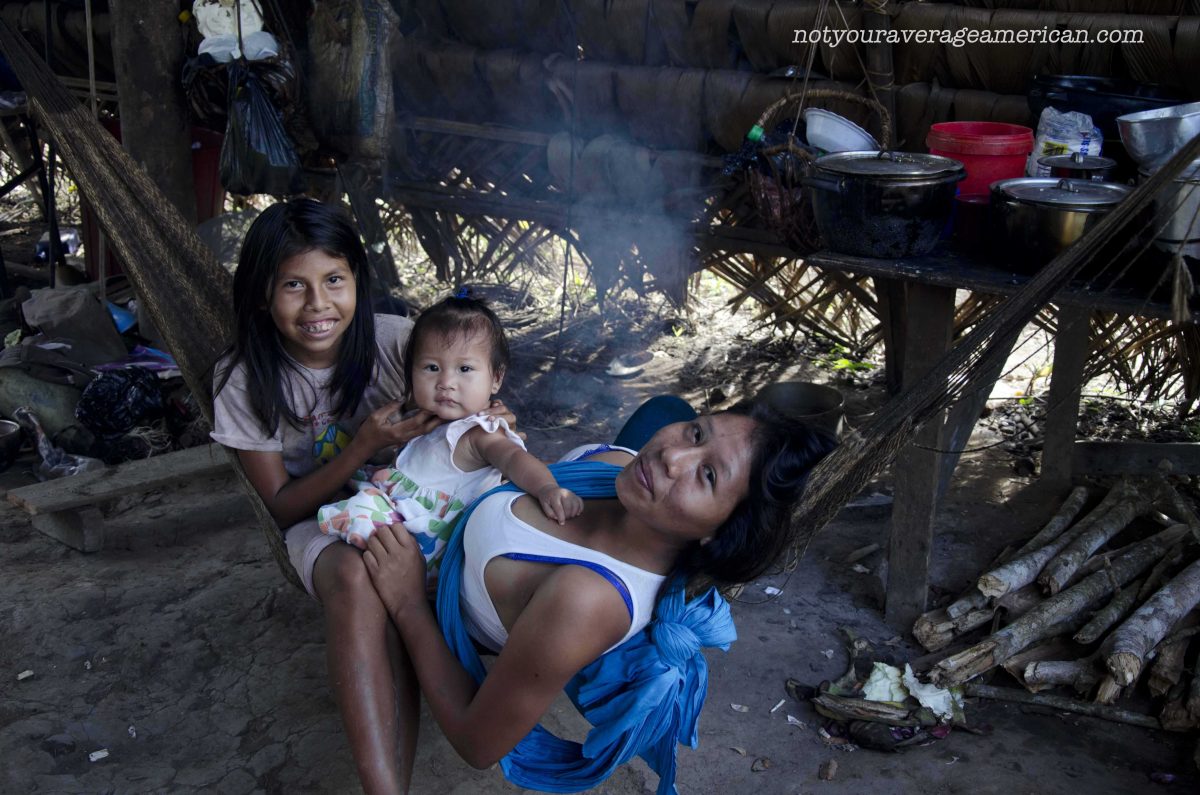 These are some of the local villagers who benefit from tourism dollars. If you look carefully, you will see their home has many modern items mixed in with many traditional ones | ©Angela Drake