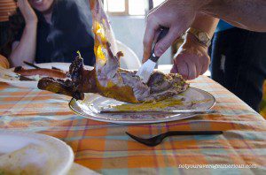 Carving the cuy so that more than one person can have a taste |©Angela Drake