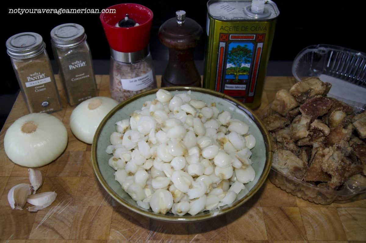 Hominy or Mote, onion, garlic, chicharron or other salty meat, spices, and olive oil, butter, or lard.