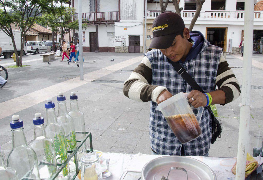 Preparing to juggle the mixture of steeped fruit juices and aloe to make a drink sure to cure whatever ails your stomach. Works best when taken once a day.