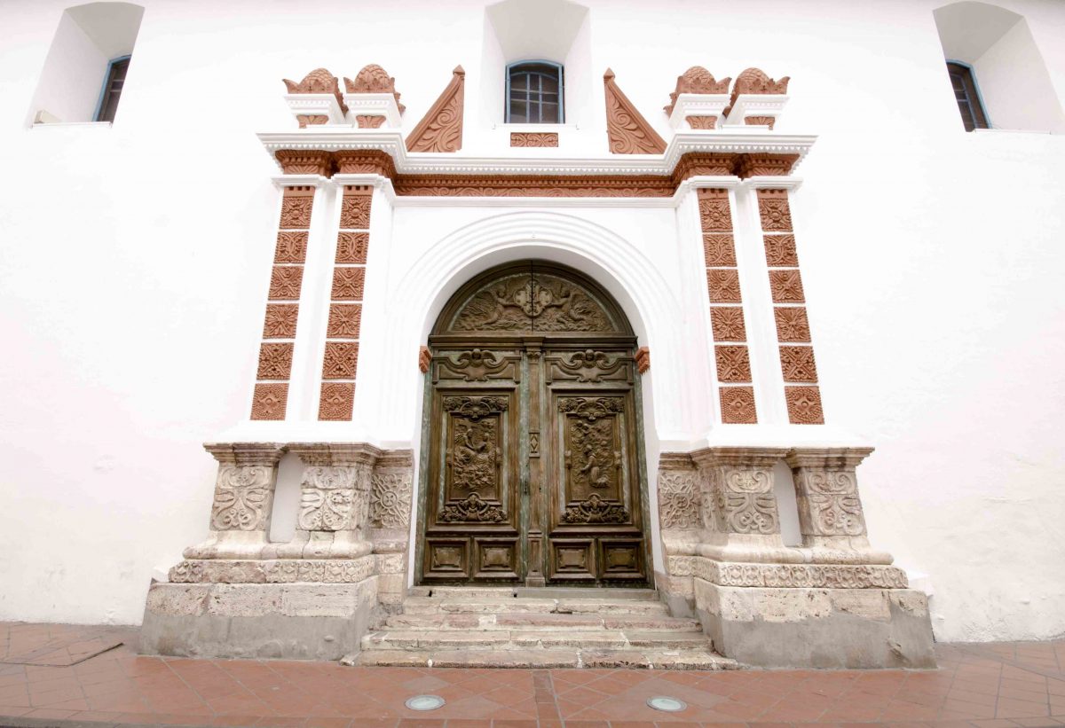 Carved wooden doors of the Iglesia de las Conceptas, Cuenca, Ecuador