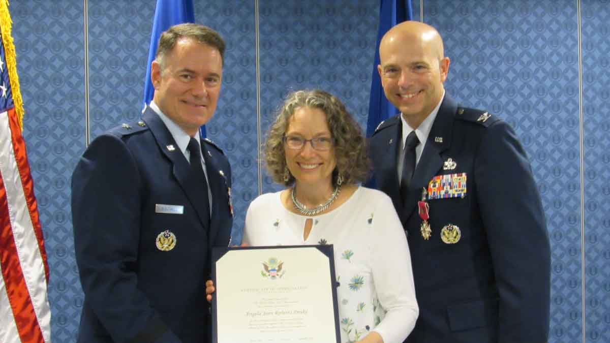 Air Force Retirement Photo with Brigadier General Bourwell, Angie Drake, and Colonel E. Scott Drake