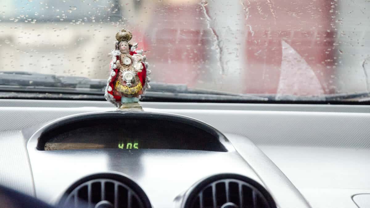 Many Ecuadorians put their faith in religious symbols when they take to the road. | ©Angela Drake