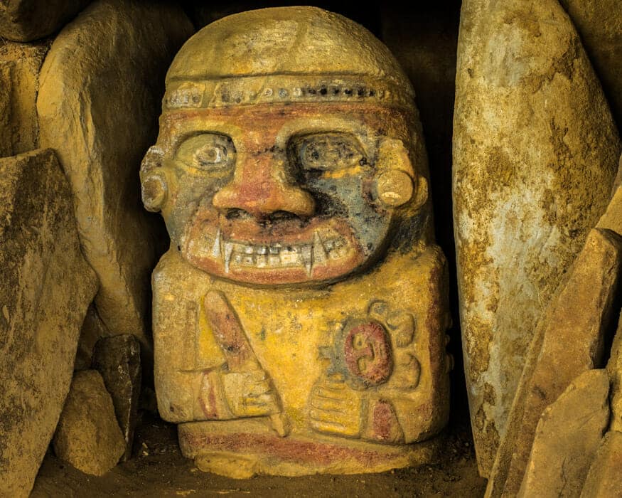 Detail of the painted figure threatening a child, La Pelota, San Agustin, Colombia | ©Ernest Scott Drake