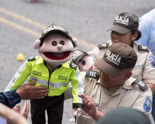 Police with Puppets; Mama Negra Parade, Latacunga, Ecuador | ©Angela Drake
