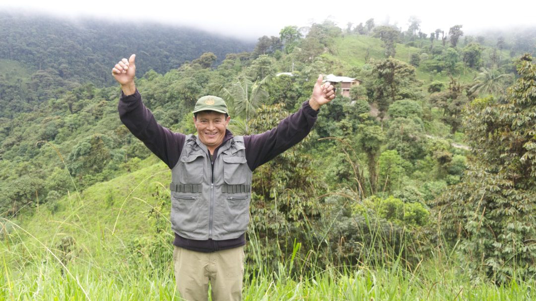 Angel Paz, the Antpitta Whisperer, stands proudly before his dream, the Refugio Paz de las Aves | ©Angela Drake