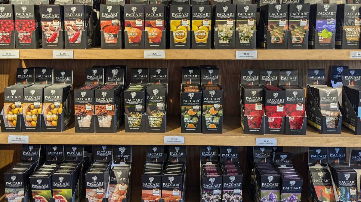 Three shelves of Pacari Chocolate bars in a myriad of amazing flavors.