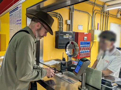 A gringo buying tickets at a Quito Metro station