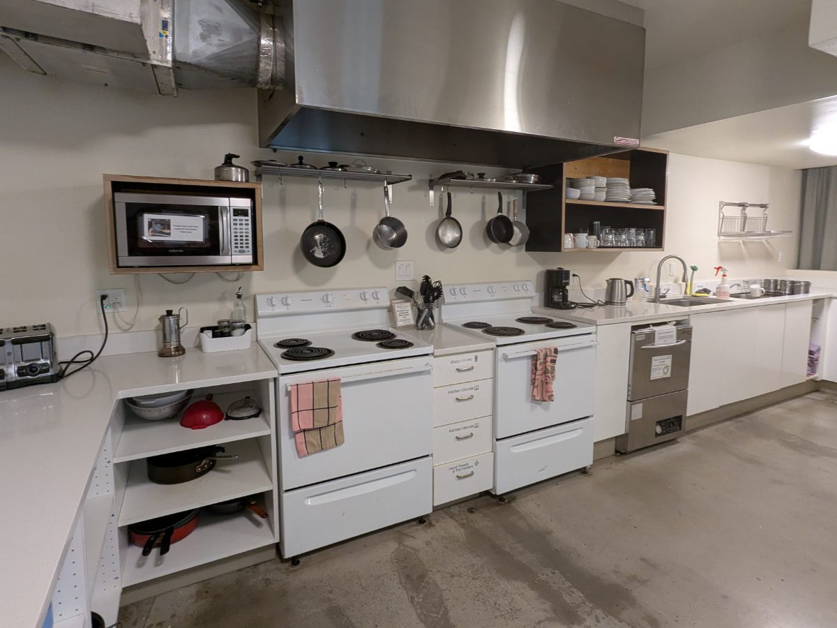 Communal Kitchen Communal Kitchen at the NW Portland Hostel includes stove, refrigerators, sink, pots, pans, utensils, dishes, and more.