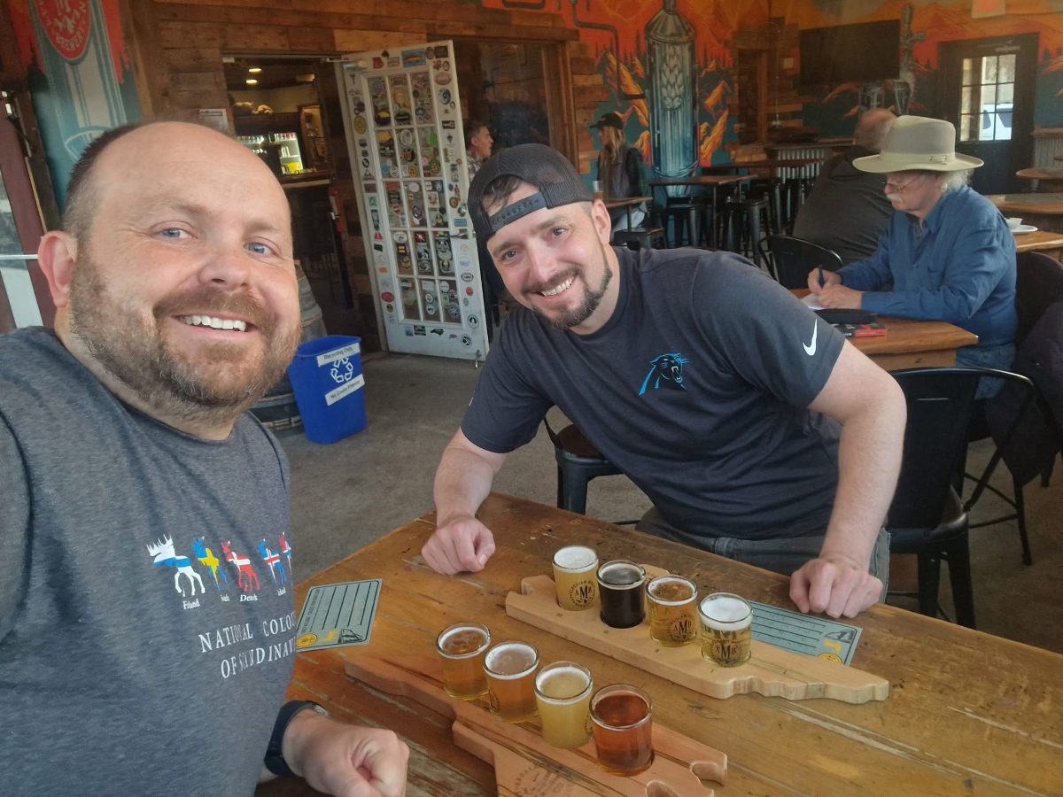 Enjoying a flight at Appalachian Mountain Brewery - open for business Phil and a friend at Appalachian Mountain Brewery (AMB) in Boone, North Carolina enjoying flights of beer.