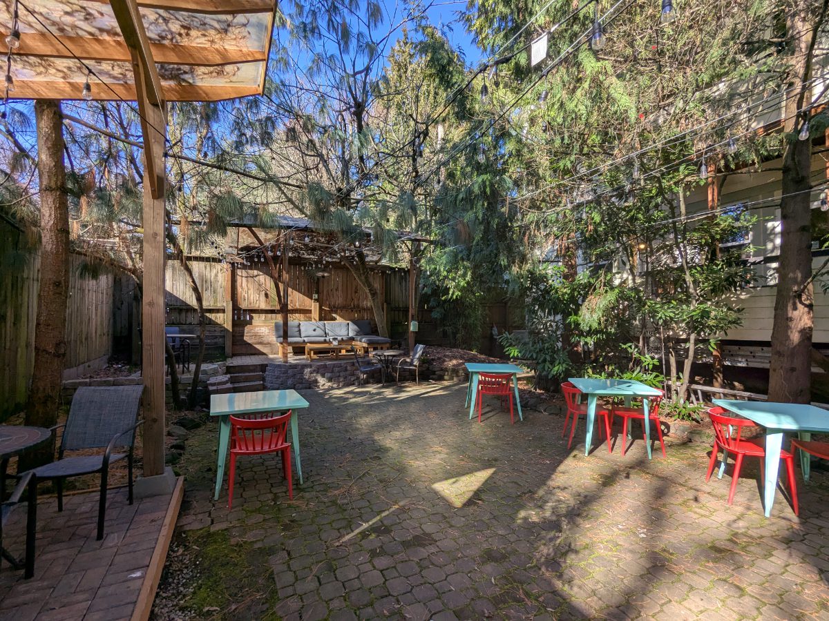 Hang out on the patio at NW Portland Hostel Outdoor patio at NW Portland Hostel includes plenty of tables, chairs, a bbq and trees for shade on a hot summer day.