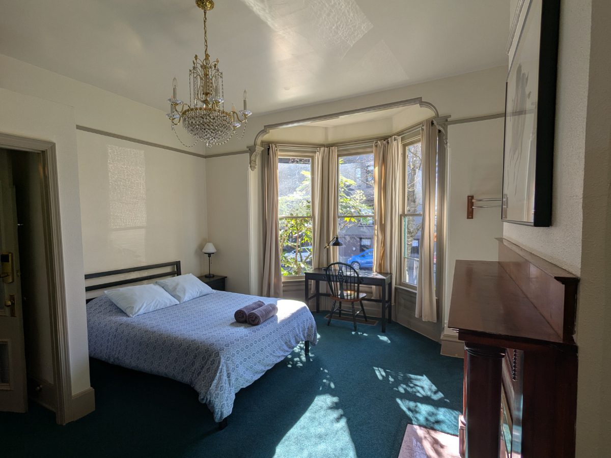 Spacious Room in Historic Home An ample bedroom with Queen bed in an historic home at the NW Portland Hostel