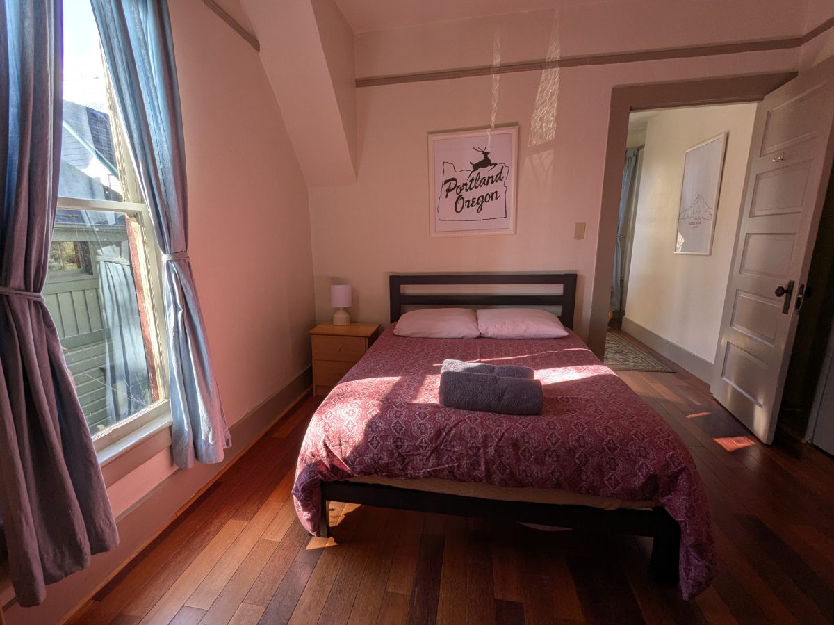 Sunny Bedroom Welcomes You To Portland A sunny bedroom in one of the older homes, part of the NW Portland Hostel campus.