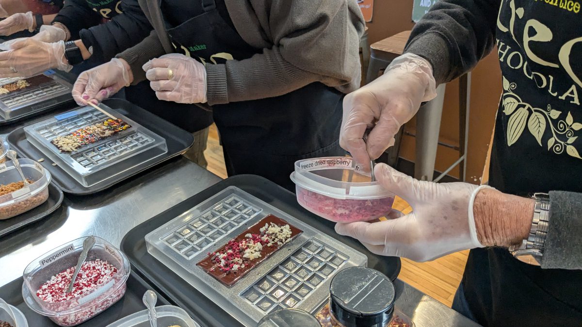An assembly line of chocolate apprentices making their own bars at Creo in Portland, Oregon