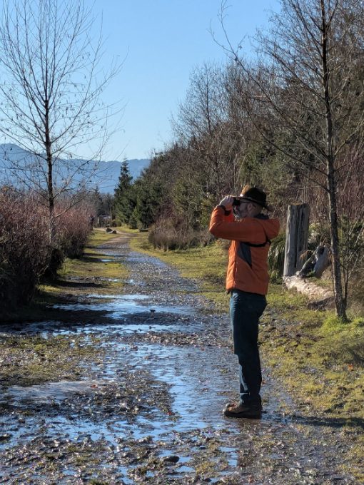 Scott wearing a Craft Sportswear Men's ADV Explore Lightweight Jacket while birdwatching on a sunny day in Oregon
