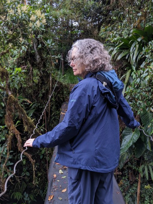 Angie wearing a Craft Sportswear Women's CORE Explore Shell Jacket while birdwatching in the Amazon.