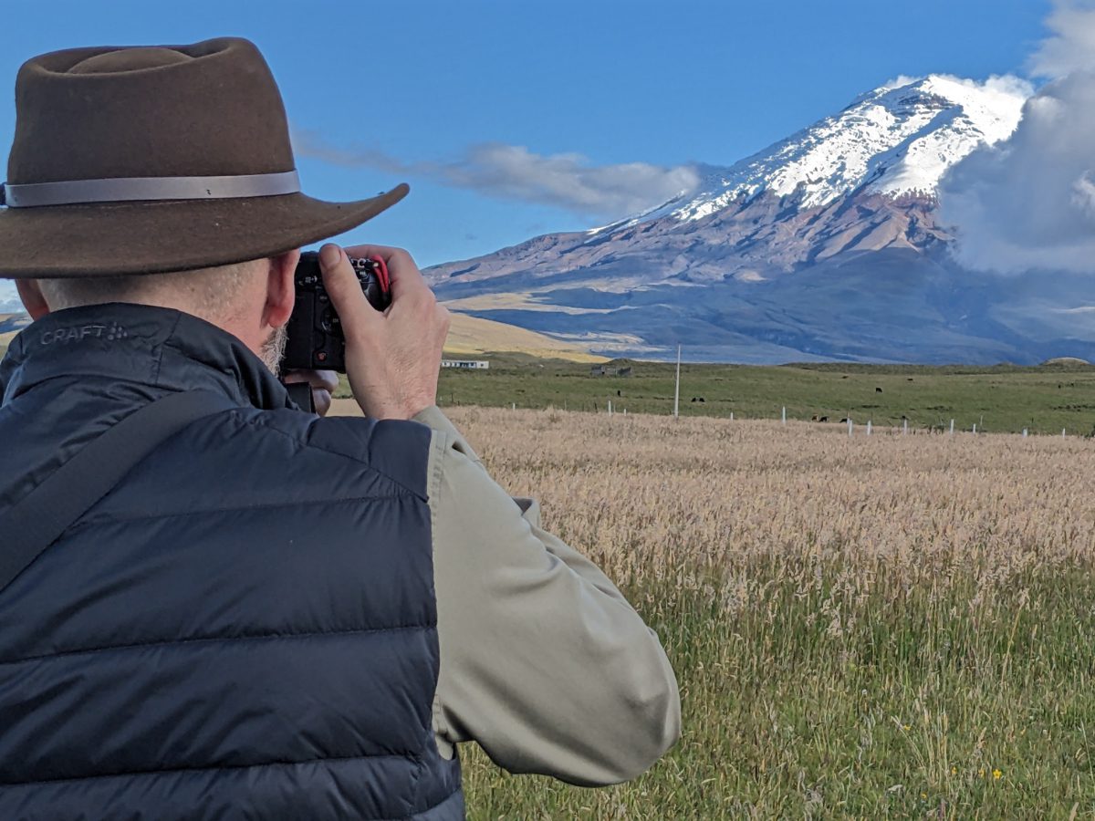 Scott wearing a Craft Sportswear Men's ADV Explore Light Down Vest while photographing the Cotopaxi Volcano