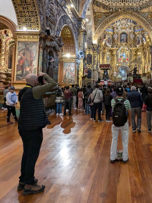 Scott wearing his Craft Sportswear Men's ADV Explore Light Down Vest while photographing Good Friday in Quito's San Francisco Church. 