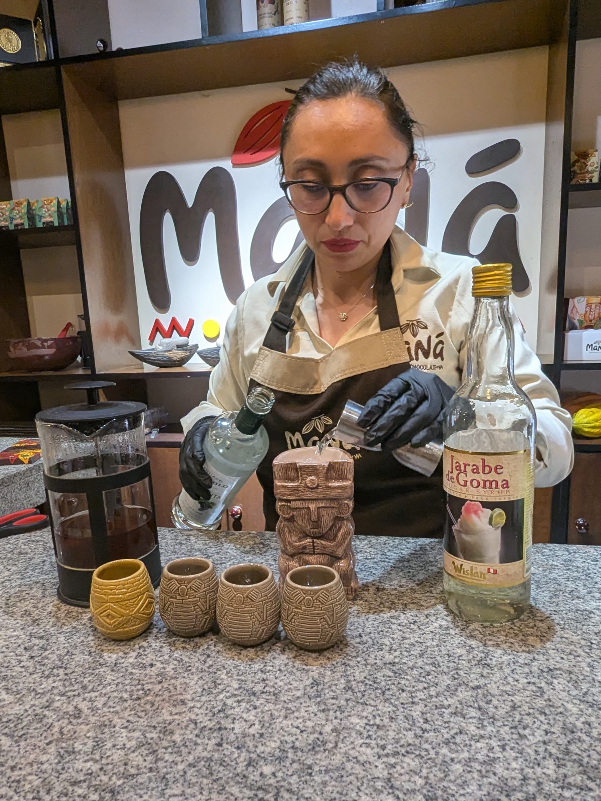 Giannini mixes pisco with tea made from cacao bean shells to make a chocolate chilcano.