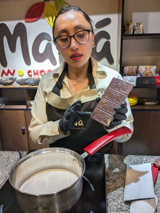 Giannini explains the process of making hot chocolate in the Spanish-style using a Maná chocolate bar.
