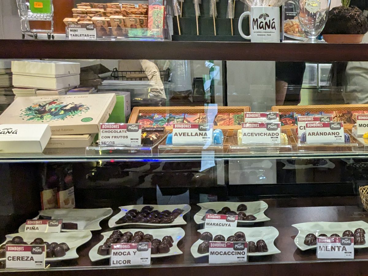 A selection of Maná chocolates in a glass case.