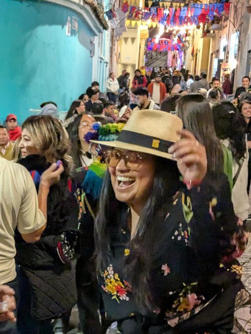 Jacquie dancing with joy to music from a Banda del Pueblo on the streets of La Ronda