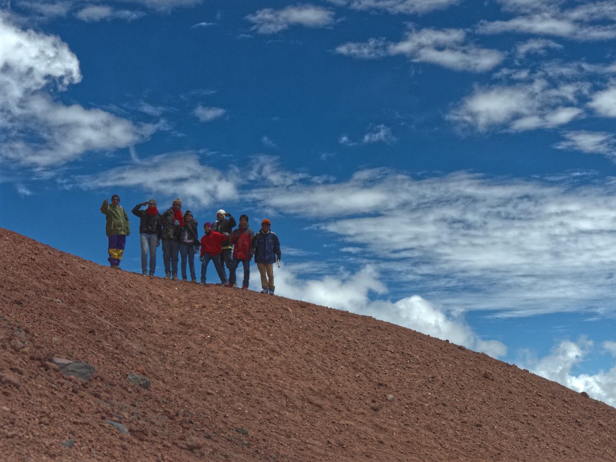 Group of Colombian hikers on Cotopaxi's Refugio Trail in Ecuador