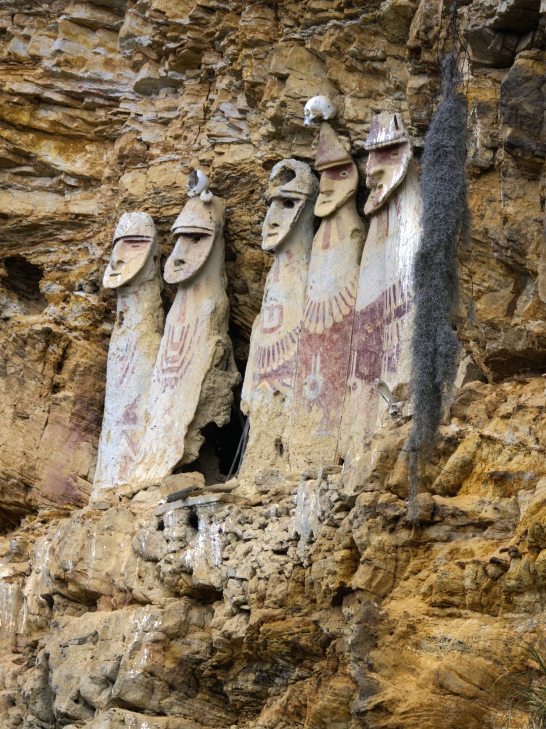 Five sarcophagi, also called the Warriors of Karajia, stand on the edge of a crumbling precipice