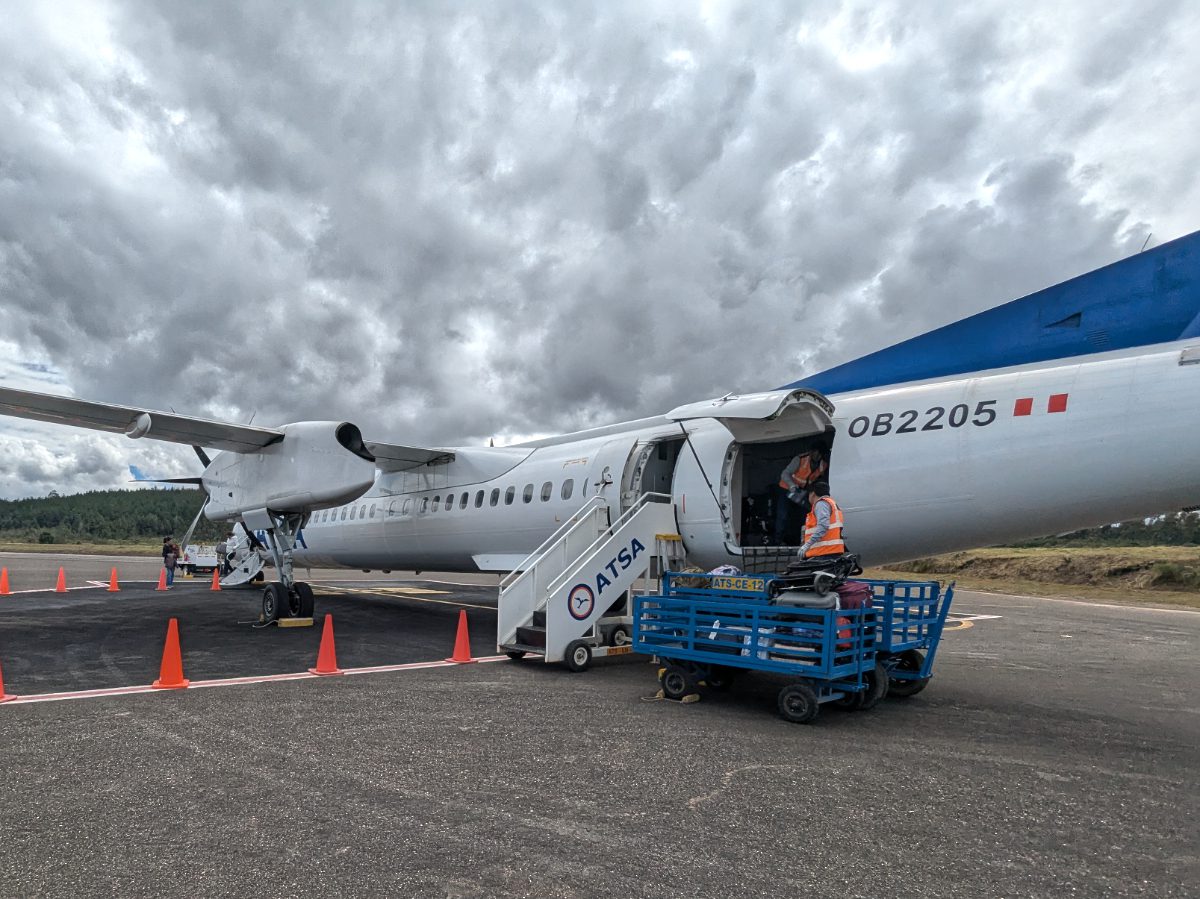 Loading baggage onto a small, regional jet flying from Chachapoyas to Lima, Peru