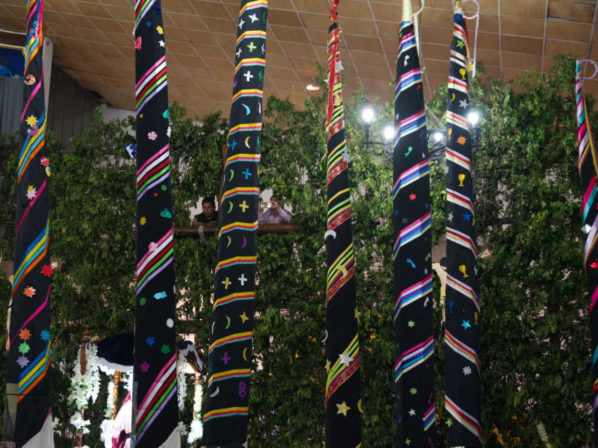 A selection of Almas Santas, huge black spires decorated with colorful ribbons