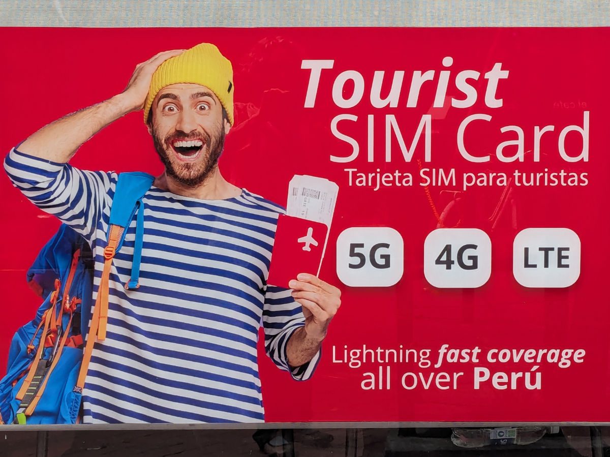 A sign in the window of a money exchange in Lima, Peru offers Tourist SIM cards for sale.