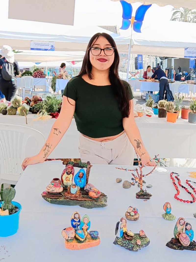 Yasmin Guaita selling her stone artwork.