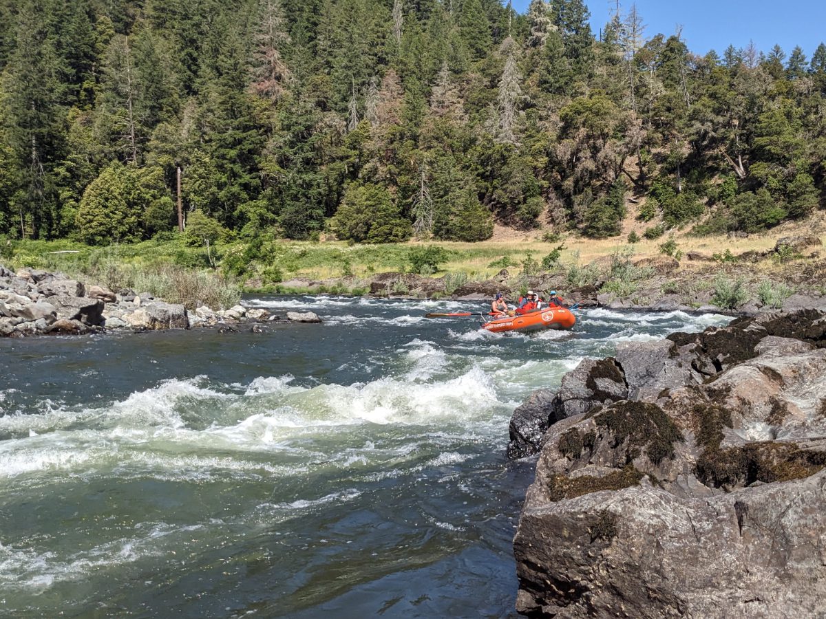 A raft takes the turn at Lower Horseshoe Bend on the Rogue River