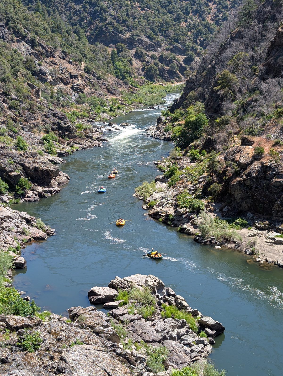 Several rafts lined up along the Rogue River near Graves Creek