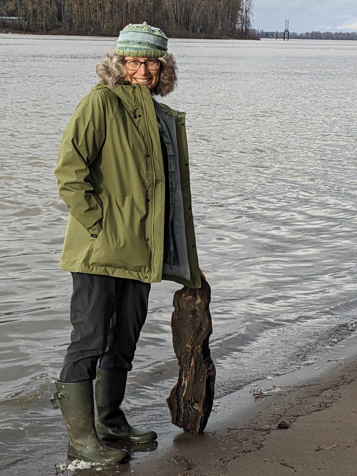 Angie wearing a Finisterre Raincoat (Skybird) while beach combing along the Willamette River