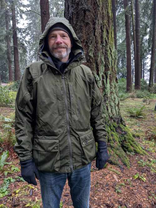 Scott wearing his Halkon raincoat by Paramo on a rainy walk in Pier Park