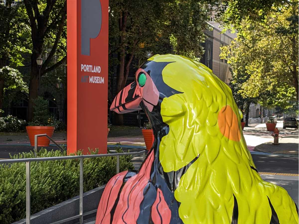 A head and shoulders shot of Bloom, a crow statue outside the Portland Art Museum. 