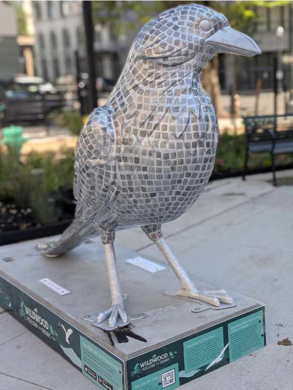 The Mirroball Messenger is painted to resemble a disco ball in homage to the namesake of the plaza where it stands, Darcelle XV
