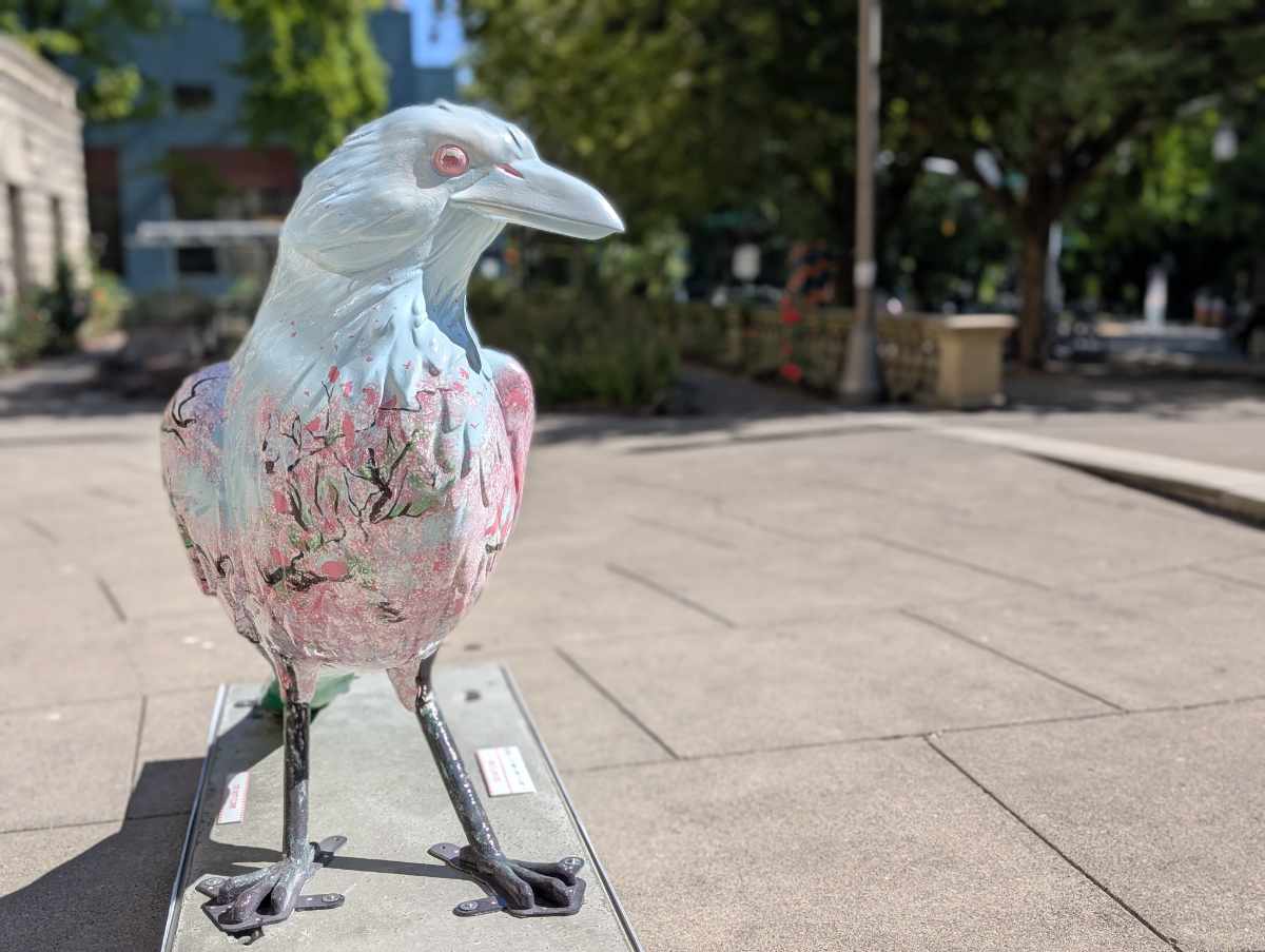 Sakura Hanami, a 5-foot crow statue painted in pale blue with a spattering of pink cherry trees across its breast sits in the plaza in front of City Hall.